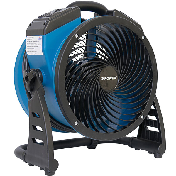 A blue and black XPOWER industrial axial fan with a stand.