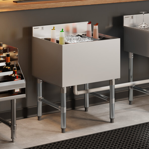 A stainless steel underbar ice bin with bottle holders and a cold plate, designed for commercial bar use.