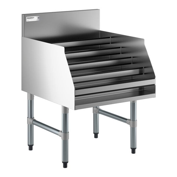 A five-tiered stainless steel liquor display rack with a backsplash and sturdy legs.