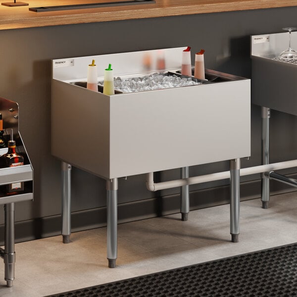 Regency IB213012 21" x 30" Stainless Steel Underbar Ice Bin with Bottle Holders - 98 lb.