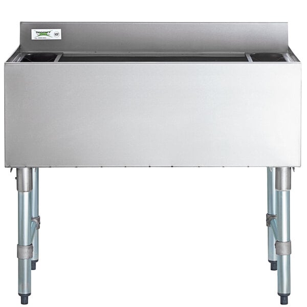A stainless steel rectangular tub with legs.
