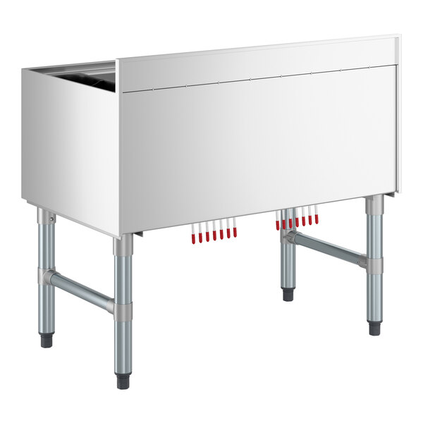 A stainless steel underbar ice bin with a 7 circuit post-mix cold plate and bottle holders.