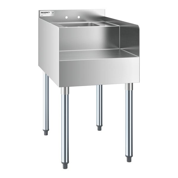 A stainless steel station with four legs, a raised back and sides, and a small integrated sink.