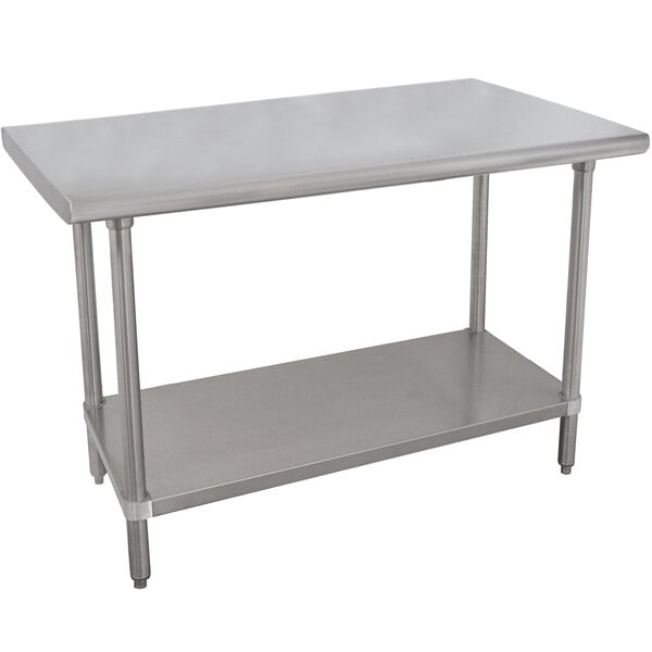 An Advance Tabco stainless steel work table with a stainless steel undershelf.