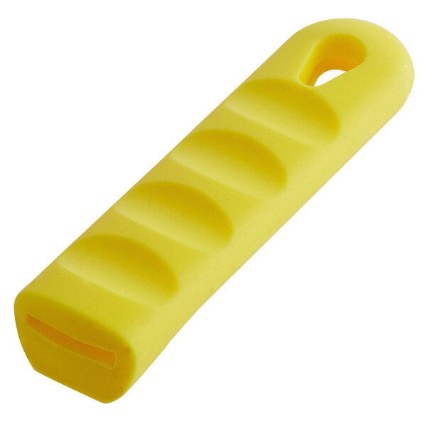 A yellow silicone pan handle sleeve with a hole in the end.