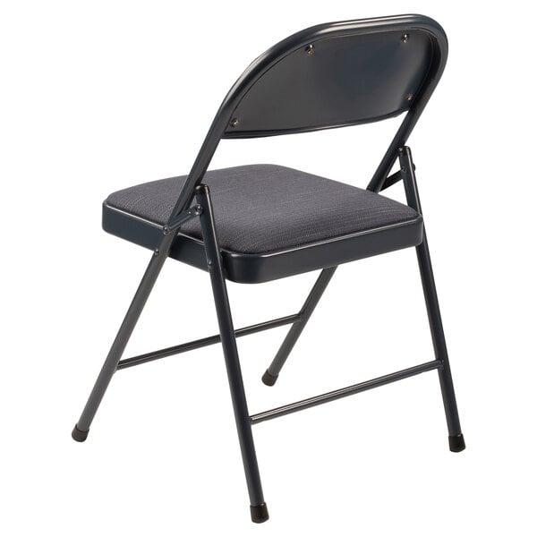 A National Public Seating blue metal folding chair with a blue padded seat.