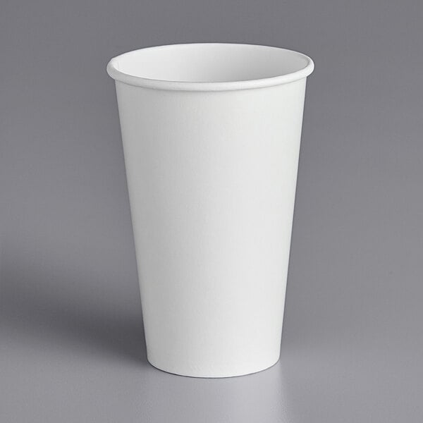 A white Choice paper cold cup on a gray surface.