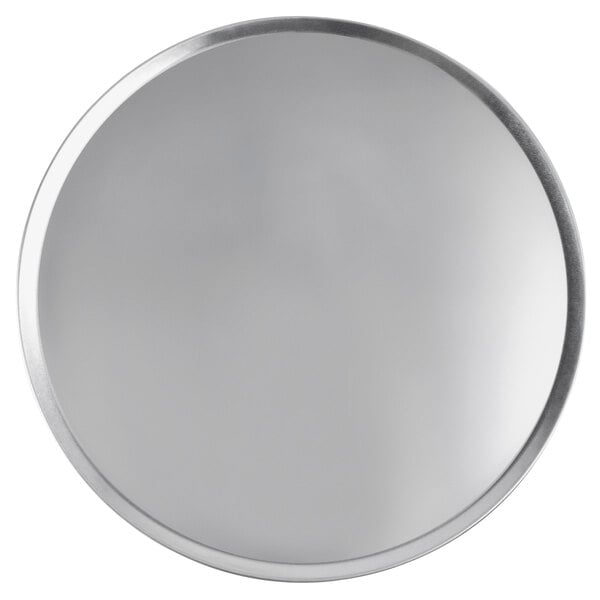 A close-up of a round silver Vollrath pizza pan.