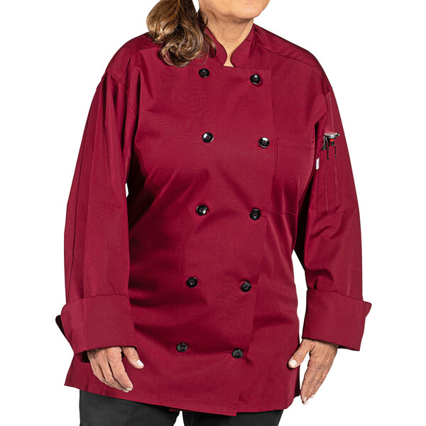 a woman wearing a red chef coat