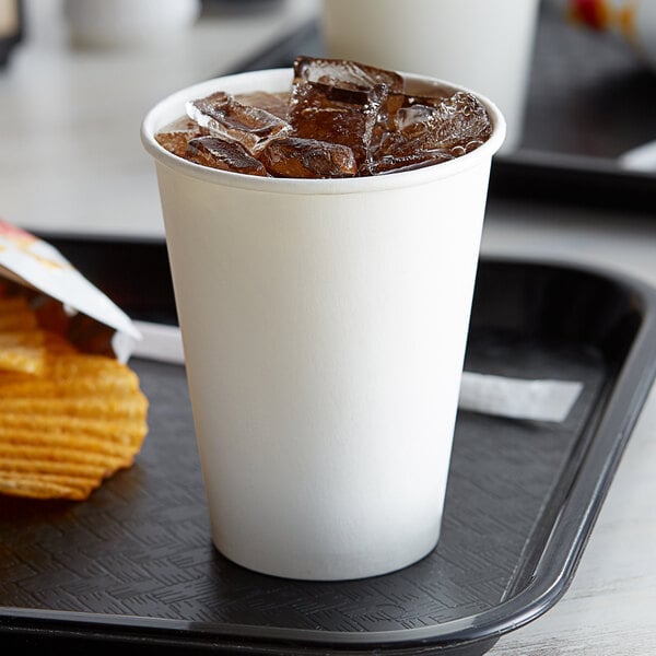 A tray of Choice white poly paper cold cups filled with ice.