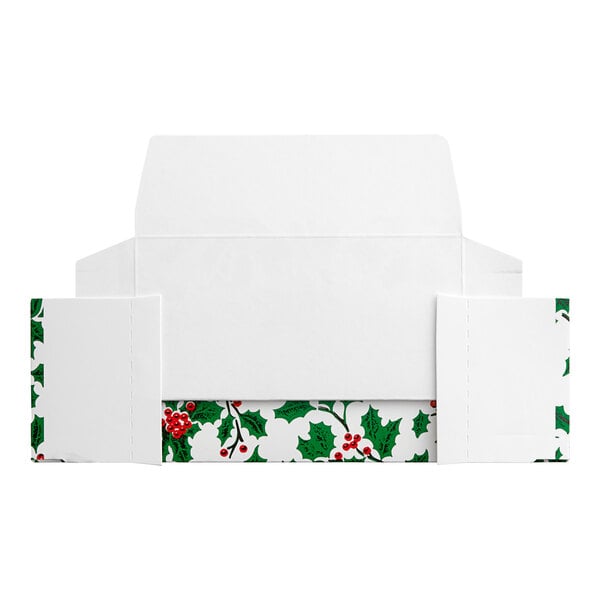 A white paper with green leaves and red berries.