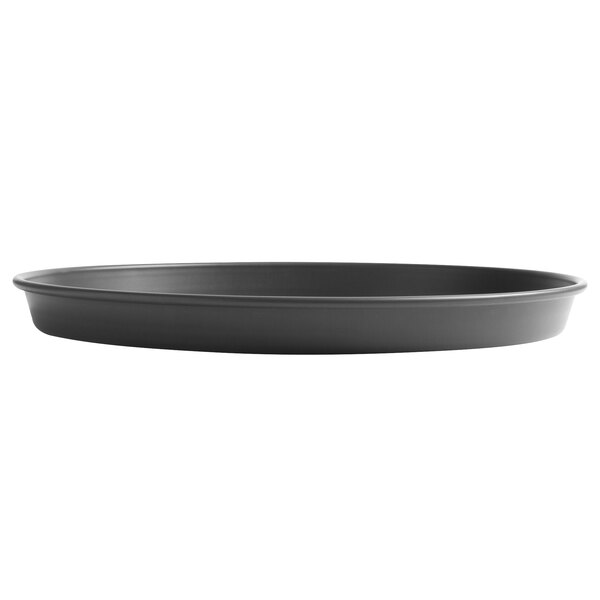 A black round pan with a white background.