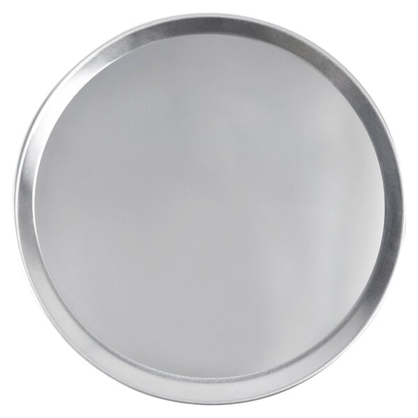 A close-up of a round silver tray with white background.