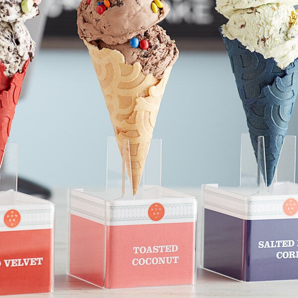 A Konery Toasted Coconut Waffle Cone Stand holding three ice cream cones.