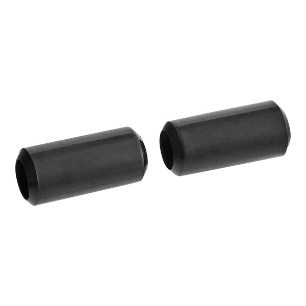 A close-up of two black cylindrical tubes.