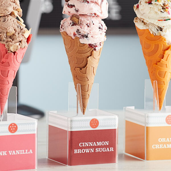 a close up of a pink ice cream cone