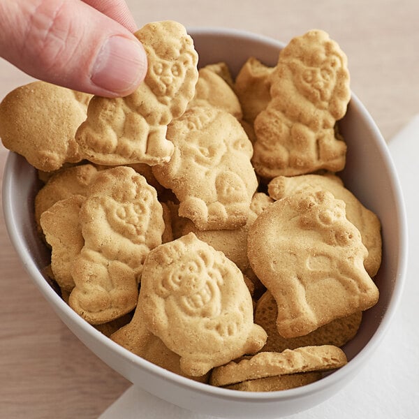 A bowl of KEEBLER animal crackers with animal shapes on them.