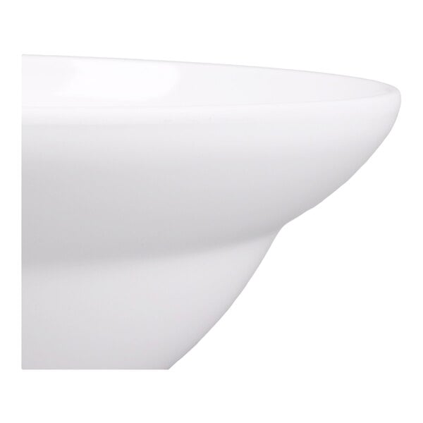 A close-up view of a smooth, white, round bowl with a gently curved edge.
