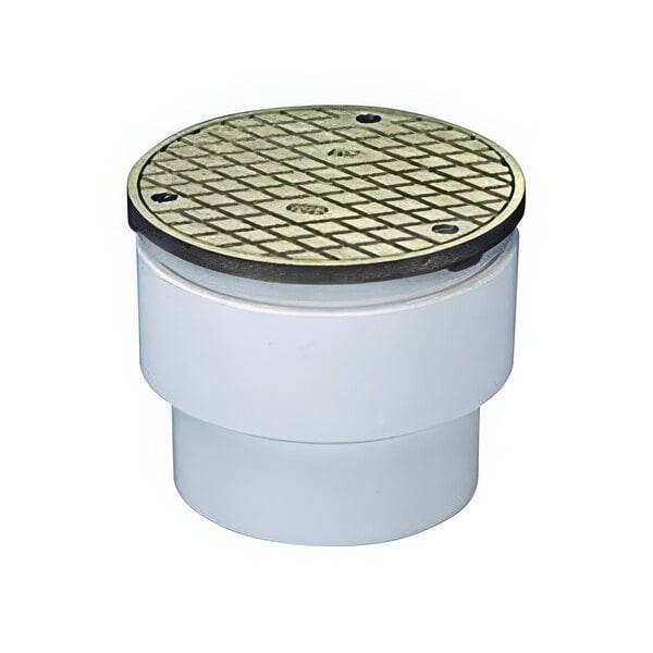 A white plastic floor drain with a round metal lid.