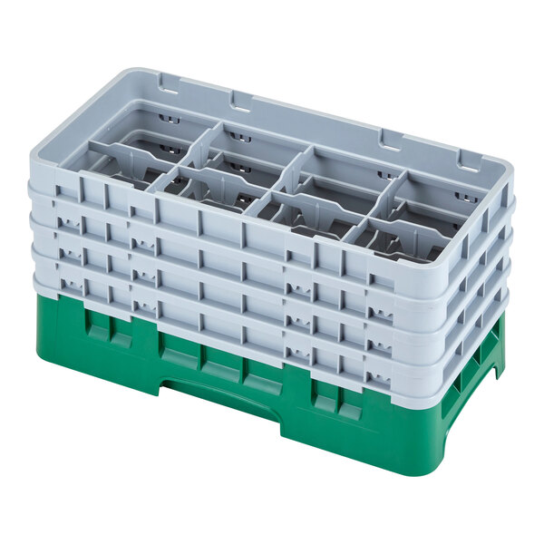 A white and green plastic Cambro glass rack with eight compartments.