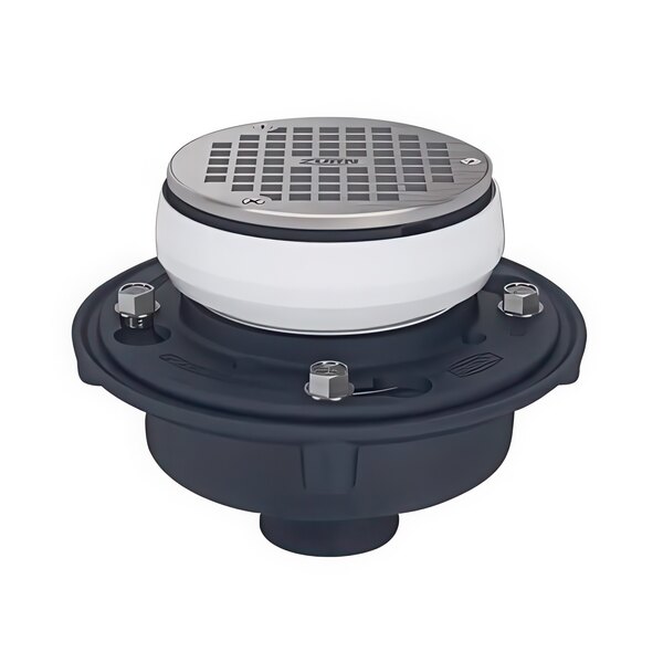 A round white and black floor and shower drain with a silver circle.