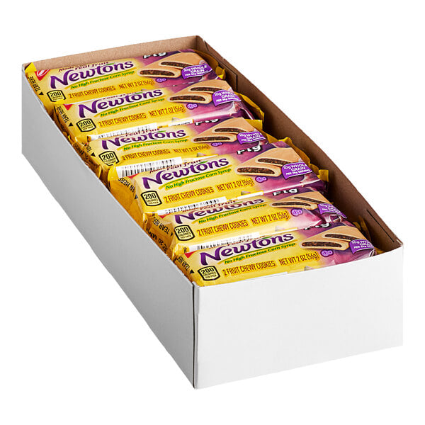 A white open box containing multiple individually wrapped packs of Newtons fig cookies.