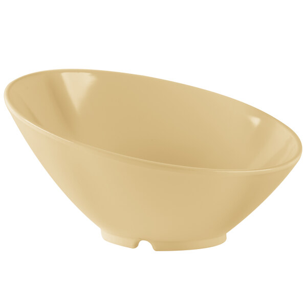 A beige slanted melamine bowl with a white background.