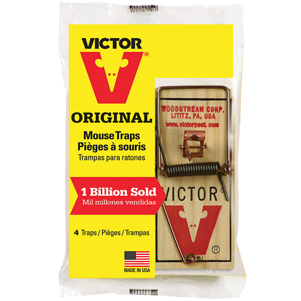 A plastic bag containing 4 Victor original metal pedal wood mouse traps.