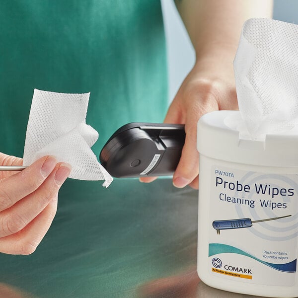 a person holding a device to wipe the body of a person