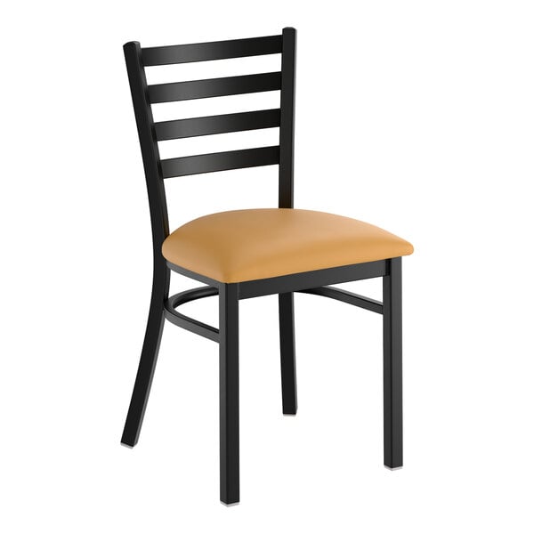 A black ladder back chair with a light brown vinyl padded seat.