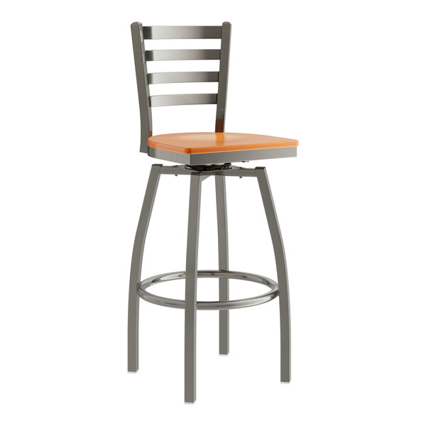 A Lancaster Table & Seating metal bar stool with a cherry wood seat.