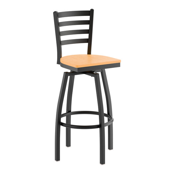 A black metal ladder back swivel bar stool with a natural wood seat.