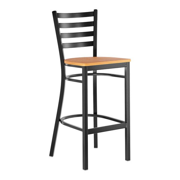 A black metal ladder back bar stool with a natural wood seat.