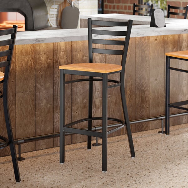 Lancaster Table & Seating Black Finish Ladder Back Bar Stool with Natural Wood Seat