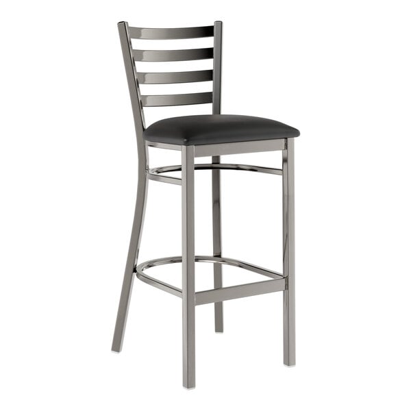 A metal bar stool with a ladder back design and a black vinyl padded seat.