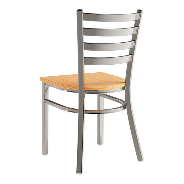 A Lancaster Table & Seating metal chair with a wooden seat and back.