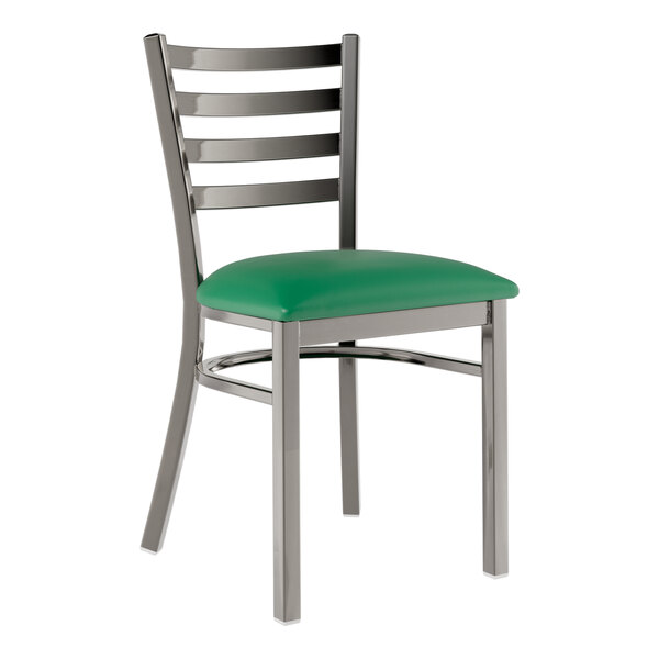 A Lancaster Table & Seating metal chair with a green vinyl seat and ladder back.