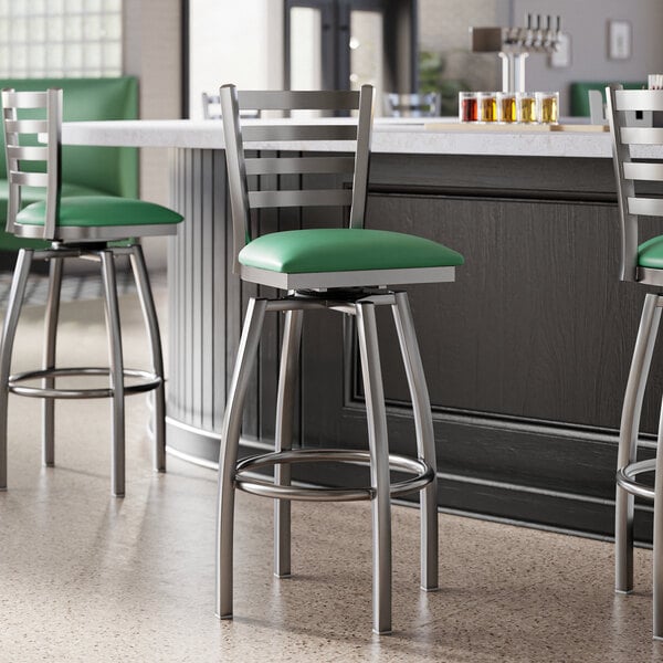 Lancaster Table & Seating Clear Coat Finish Ladder Back Swivel Bar Stool with 2 1/2" Green Vinyl Padded Seat