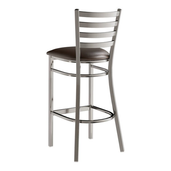 A Lancaster Table & Seating metal bar stool with a dark brown leather seat.
