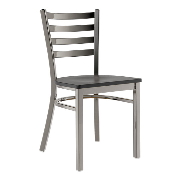 A Lancaster Table & Seating metal chair with black wood seat and ladder back.