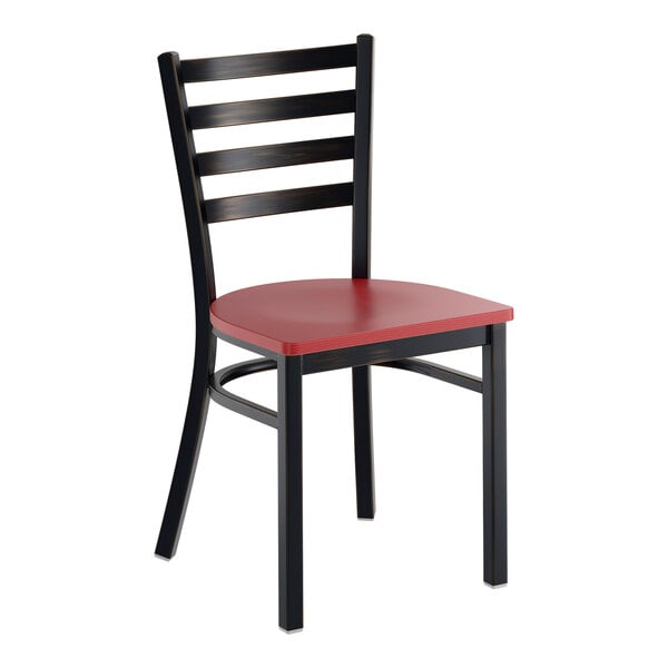 A black ladder back chair with a mahogany wood seat and a distressed copper finish.