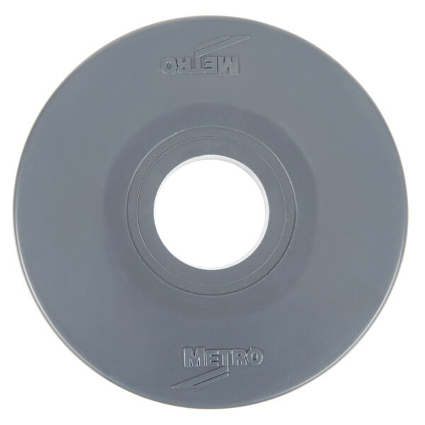 A grey circular rubber disc with text in the middle that reads "Metro"