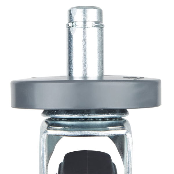 A black rubber object with a metal base.