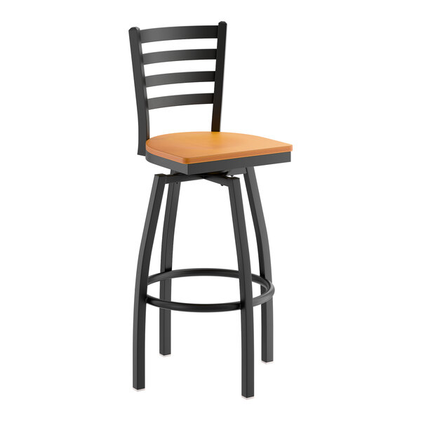 A black metal ladder back swivel bar stool with a cherry wood seat.