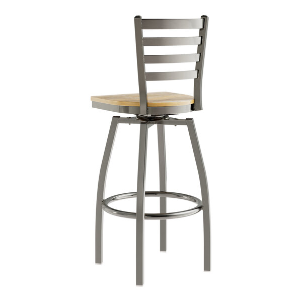 A Lancaster Table & Seating metal bar stool with a driftwood seat.