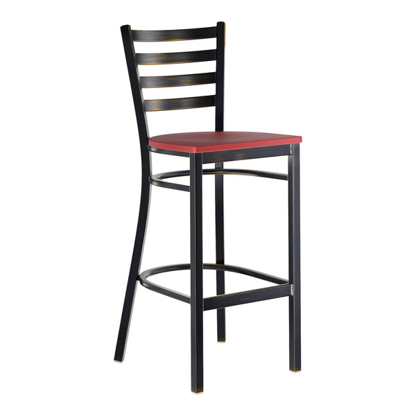 A metal bar stool with a distressed copper finish, ladder back design, and a mahogany wood seat.