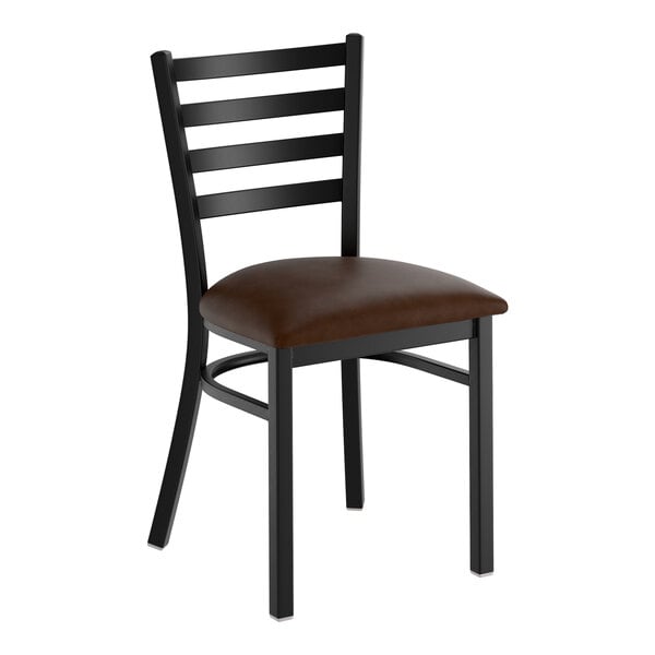 A black metal ladder back chair with a dark brown vinyl padded seat.