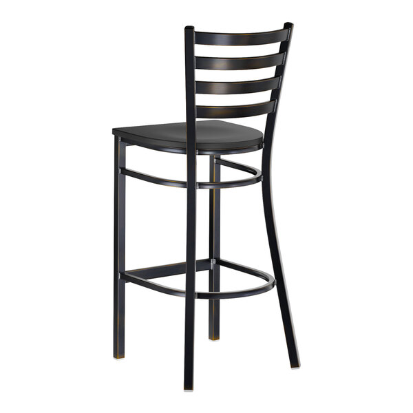 A black metal ladder back bar stool with a black wood seat and a distressed copper finish.