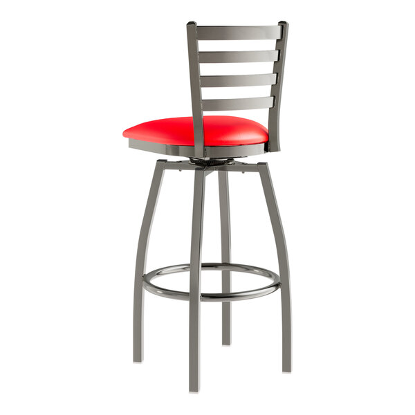 A red and silver Lancaster Table & Seating swivel bar stool with a red vinyl padded seat.