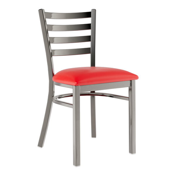 A Lancaster Table & Seating metal restaurant chair with a red vinyl cushion.